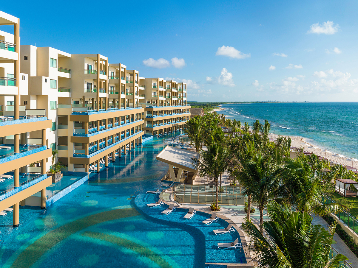 View of pool balconies and beach at Generations Riviera Maya family resort near Cancun, Mexico. 