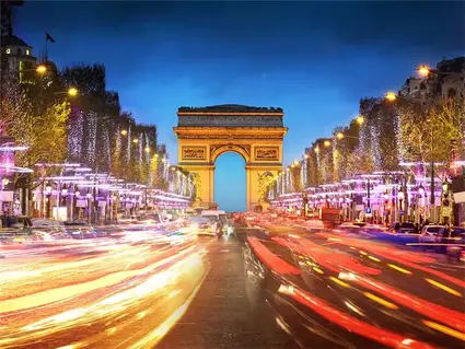 Arc de Triomphe at night.  Find destinations and experiences that you can enjoy. 